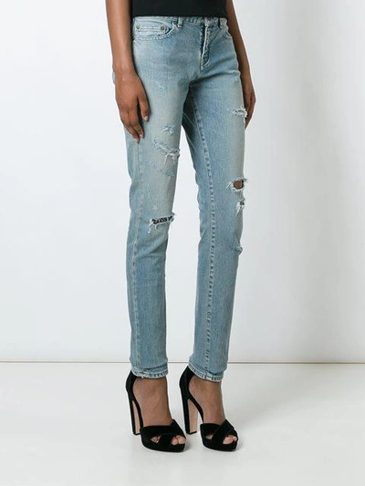Shop Saint Laurent Skinny Distressed Jeans - Blue