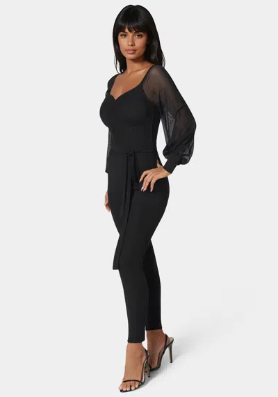 Bebe Printed Mesh Off Shoulder Catsuit In Black