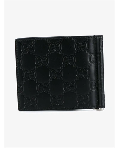 Shop Gucci Logo Embossed Leather Wallet