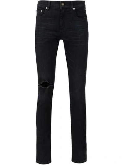 Shop Saint Laurent Distressed Skinny Jeans - Black