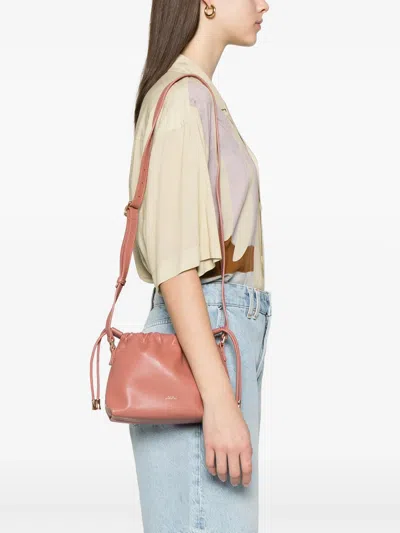 Apc Ninon Mini Pink Crossbody Bag With Embossed Logo On The Front And Adjustable Shoulder Strap In Ecole
