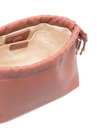 Apc Ninon Mini Pink Crossbody Bag With Embossed Logo On The Front And Adjustable Shoulder Strap In Ecole