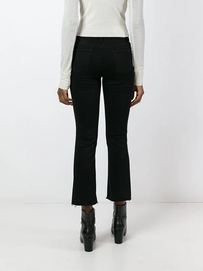 Shop J Brand Flared Cropped Jeans In J3103 Black Bastille