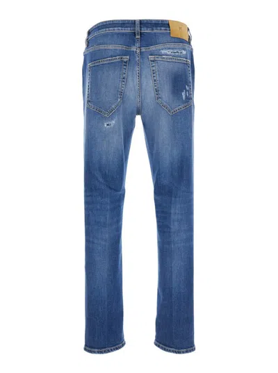 Pt Torino Blue Five Pocket Jeans With Rips And Logo Patch On The Back In Denim Man In Blue