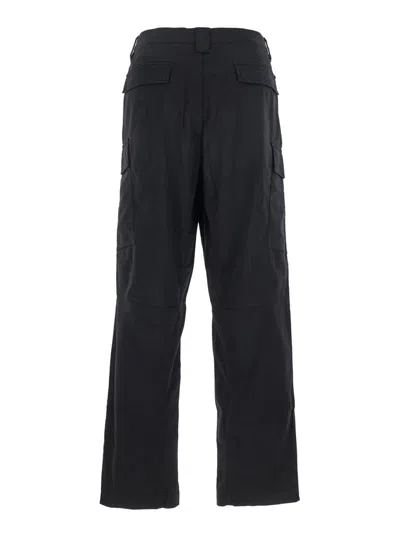 C.p. Company Black Pants With Cargo Pockets And Lens Motif On The Leg In Cotton Man In Black