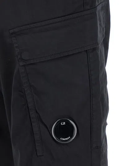 C.p. Company Black Pants With Cargo Pockets And Lens Motif On The Leg In Cotton Man In Black