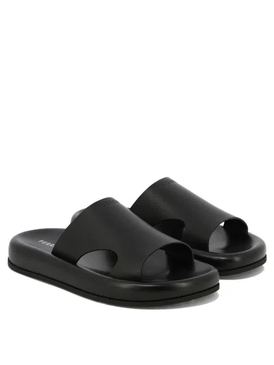 Ferragamo Logo-embossed Leather Slides In Black