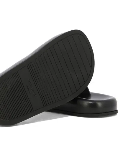 Ferragamo Logo-embossed Leather Slides In Black