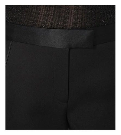 Shop Alexander Mcqueen Flared Wool And Silk-blend Trousers In Black