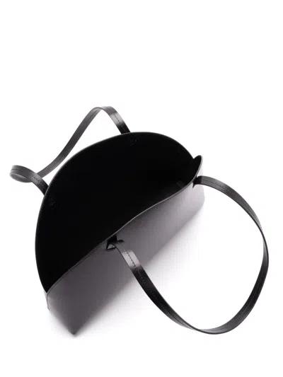 Jil Sander 'curve Medium' Black Shoulder Bag With Embossed Logo On The Front And Curved Design In Black