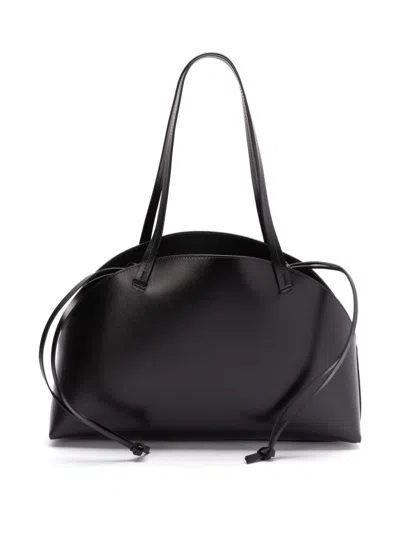 Jil Sander 'curve Medium' Black Shoulder Bag With Embossed Logo On The Front And Curved Design In Black
