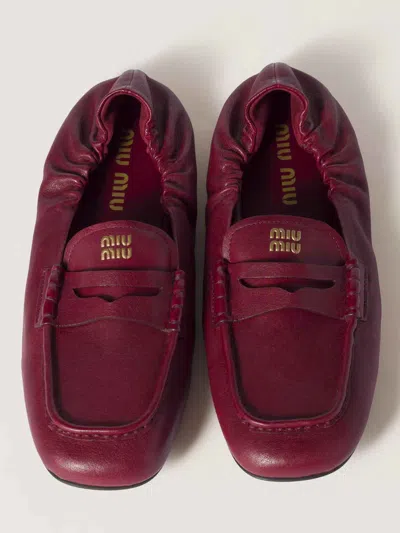 Miu Miu Logo Ruched Leather Loafers In Rubino