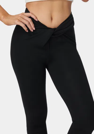Bebe Twisted Waist Flared Leg Pant In Black