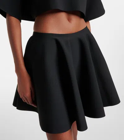 Alaïa Ribbed Flared Mid-rise Wool-blend Mini Skirt In Black