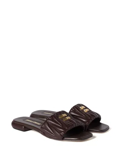 Miu Miu Matelassé Nappa Leather Slides In Brown