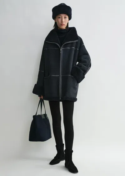 Totême Leather-trimmed Shearling Jacket In Blue