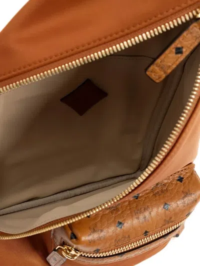 Mcm Aren Sling Backpack In Brown