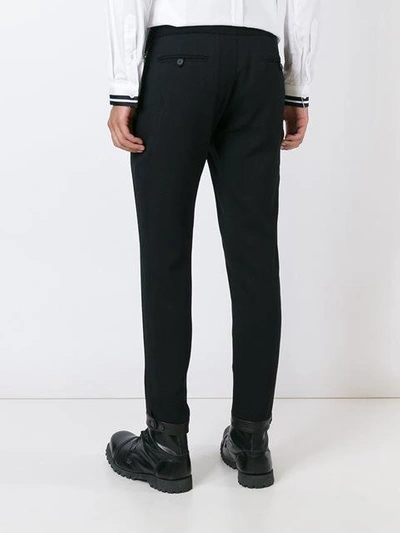 Shop Les Hommes Side Zip Tapered Trousers In Black