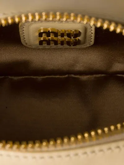 Miu Miu Zip Quilted Leather Top-handle Bag In Neutral