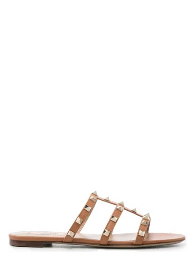 Valentino Flat Sole Rockstud Leather Sandals In Brown