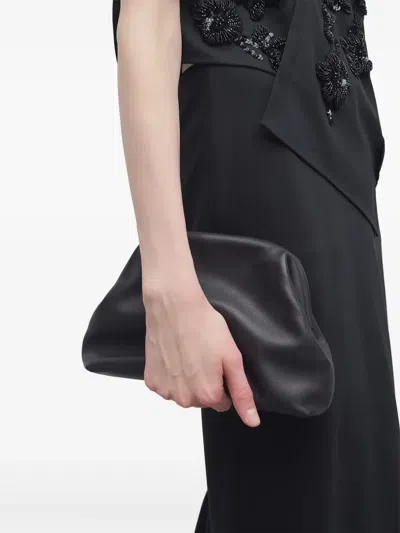 The Row Mira Clutch Bag In Saddle Leather In Black