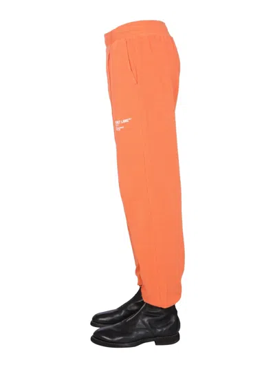 Helmut Lang Logo-print Tapered Joggers In Orange
