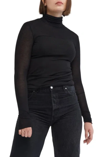 Marcella Sheer Panel Turtleneck Top In Black