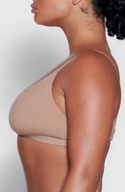 Skims Fits Everybody Wrap-effect Triangle Stretch Bralette In Sienna