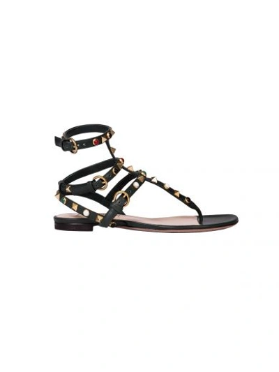 Shop Valentino Rockstud Rolling Thong Sandals In Green