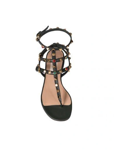 Shop Valentino Rockstud Rolling Thong Sandals In Green