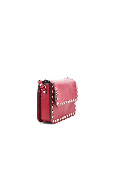 Shop Valentino Rockstud Shoulder Bag In Red