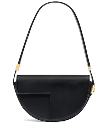 Patou Leather Shoulder Bag In Black