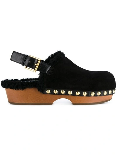 Shop Alexander Mcqueen Shearling Clogs In Black