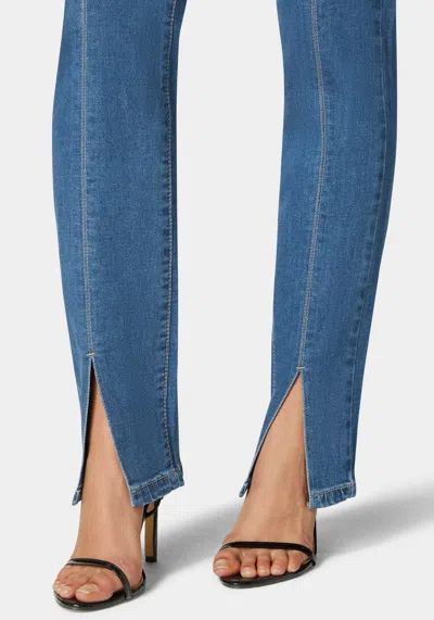 Bebe High Rise Bootleg With Hem Slit Jean In Medium Wash