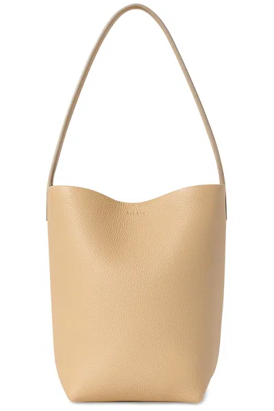 The Row Small North South Tote Bag In Brown