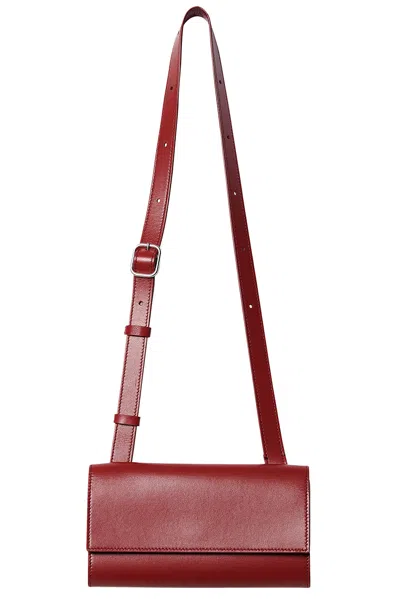 The Row Belt Flap Bag In Barn Red Ans