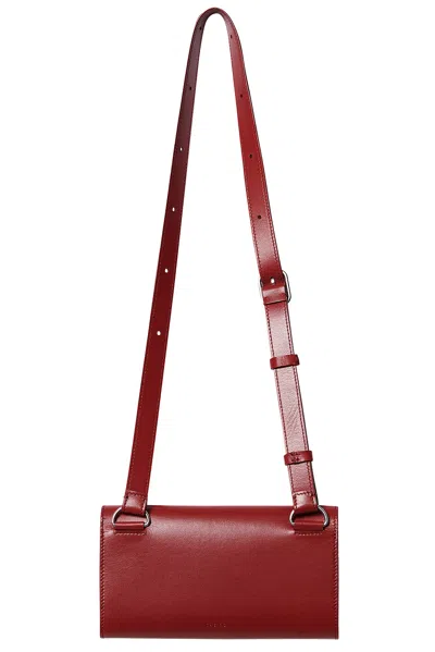 The Row Belt Flap Bag In Barn Red Ans