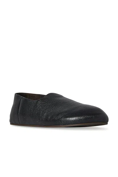 The Row Hugh Leather Slip-on Shoes In Black