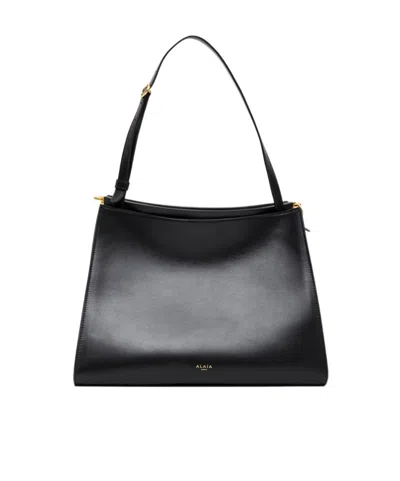 Alaïa Le Click Medium Curve Shoulder Bag In Glossy Leather In Black