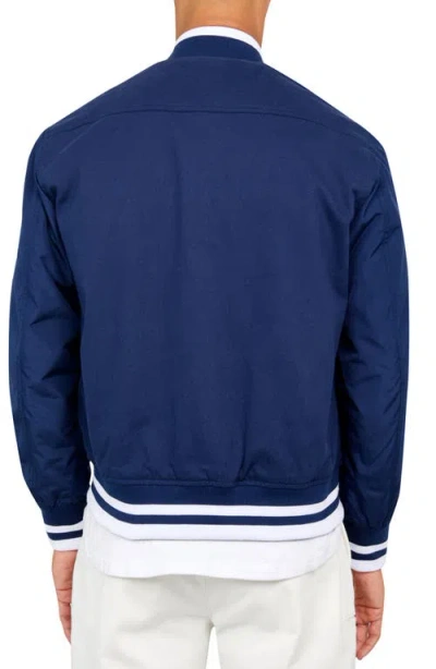Construct Solid Varsity Jacket In Navy