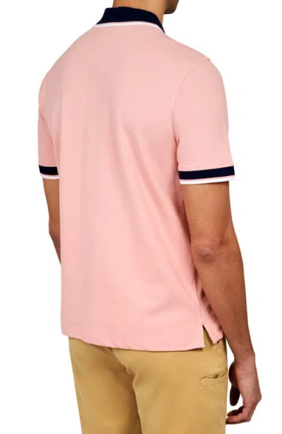 Construct Solid Pique Polo In Salmon