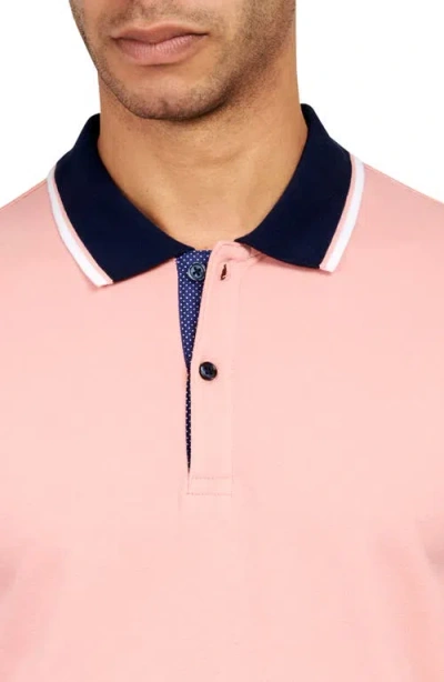 Construct Solid Pique Polo In Salmon