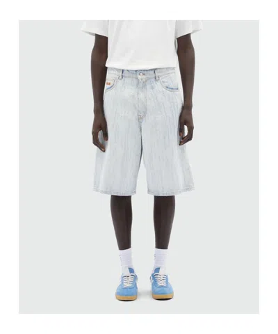 Msgm Bermuda Shorts In Light Denim With A Destroyed Effect In White