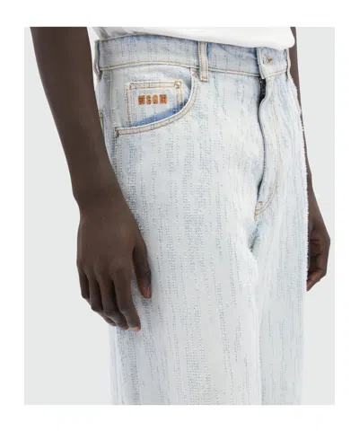 Msgm Bermuda Shorts In Light Denim With A Destroyed Effect In White