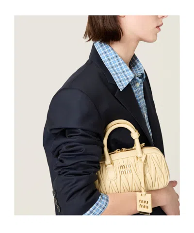 Miu Miu Zip Quilted Leather Top-handle Bag In Neutral