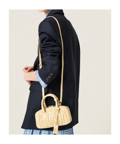 Miu Miu Zip Quilted Leather Top-handle Bag In Neutral