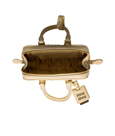 Miu Miu Zip Quilted Leather Top-handle Bag In Neutral