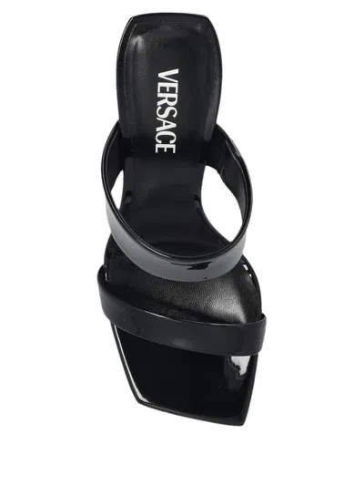 Versace Patent Leather Mules With Galvanized V-shaped Heel In Black