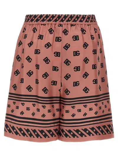 Dolce & Gabbana Pink Bermuda Shorts With Dg Logo Printed All-over In Silk Woman