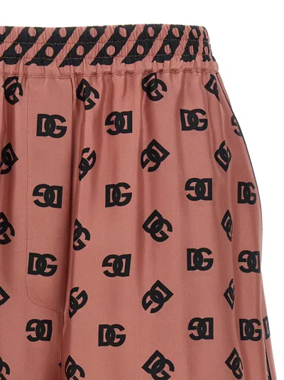 Dolce & Gabbana Pink Bermuda Shorts With Dg Logo Printed All-over In Silk Woman